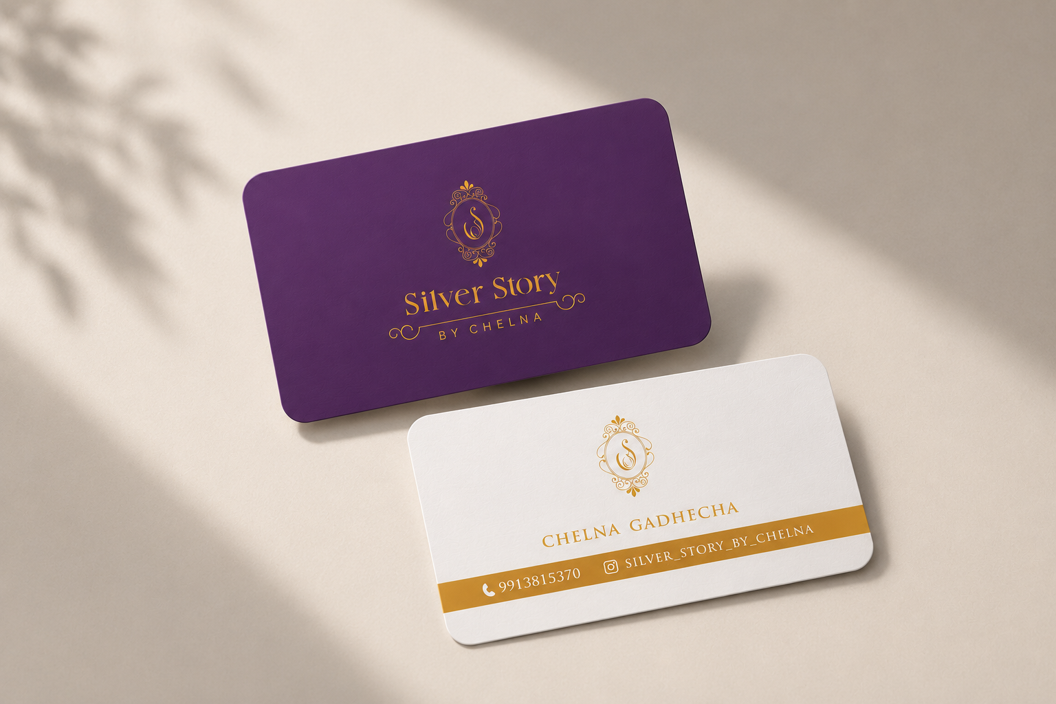 Silver Story visiting card — purple face with gold crest and cream reverse with foil band